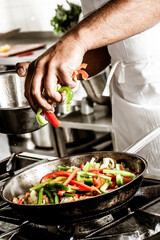 Chef Cooking Vegetables in a Pan