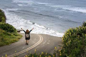 person jumping on the beach
