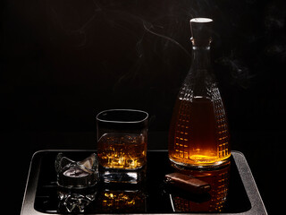 Still life with whiskey on dark background