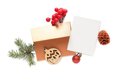 Composition with blank greeting card and Christmas decor on white background, top view. Space for text