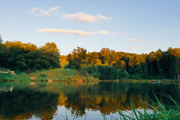Fototapeta na wymiar autumn lake forest and sunset colors