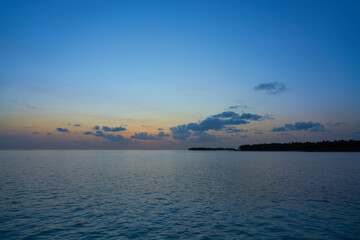 Purple blue sunset at sea in maldives
