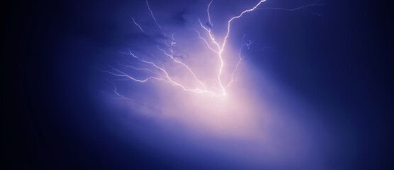 bright yellow lightning on blue dark sky