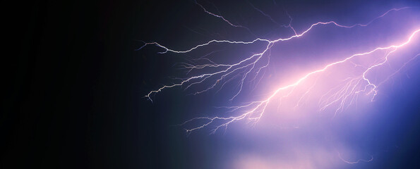 bright yellow lightning on blue dark sky
