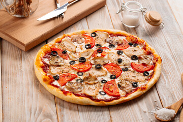 Chicken pizza with mushrooms and olives