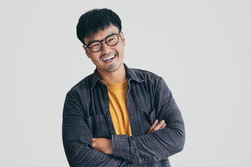 asian man portrait young male wear eye glasses smiling cheerful look thinking position with perfect clean skin posing on white background.fashion people life style concept - Powered by Adobe