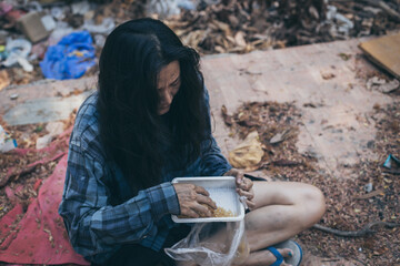 poor people,homeless or beggar begging for help sitting at dirty slum.concept for poverty...