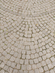 Fototapeta premium texture, pattern of light paving slabs, pavement, laid out in a semicircle