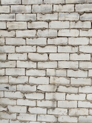 texture of rough gray brick wall, with cement between bricks