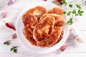 Fish cutlets on a plate on table .Top view.