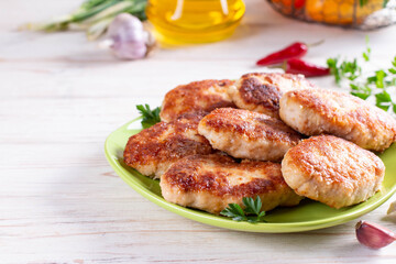 Cutlets from white sea fish in a plate on table. Copy space.