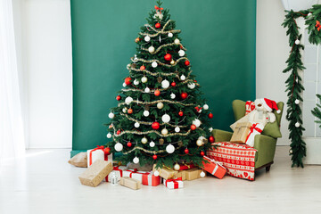 New Year's decor holiday Christmas interior of the Christmas tree pine tree gifts