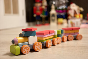 Toy locomotive made of blocks. Train with carriage.