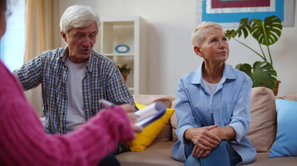 Senior husband talking to psychologist counselor complaining about bad relationship with wife