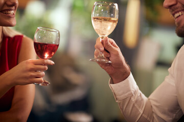 A young couple in love having a drink at Valentine's day celebration in a restaurant. Together, Valentine's day, celebration