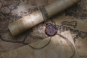 An old paper scroll sealed with a wax seal. The manuscript is rolled up and sealed.