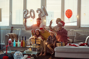 Happy family enjoying New Year eve together. New Year, holiday, family time together