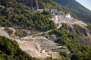 Fototapeta na wymiar Outdoor quarry of white Carrara marble on the Apuan Alps (Alpi Apuane), Tuscany, Italy, Europe.