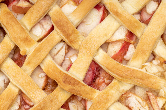 close up latticed american apple pie above view. background backdrop. studio shot. fresh traditional fruit pie