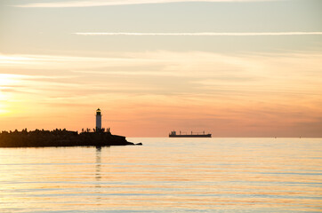 Fototapeta premium sunset lighthouse boat sea