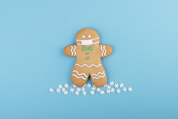 gingerbread man with a mask on his face