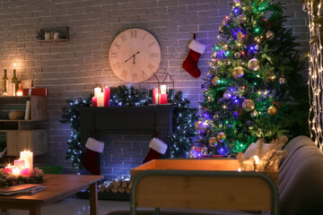Interior of living room with fireplace decorated for Christmas