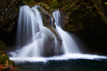 Fototapeta na wymiar Waterfall on a mountain river.