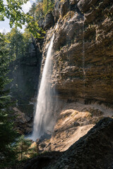 View behind Pericnik waterfall in sunlight