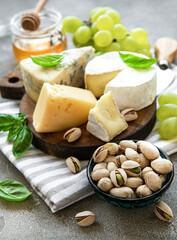 Various types of cheese and snacks