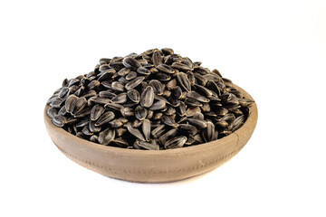 Sunflower seeds in a plate on a white background
