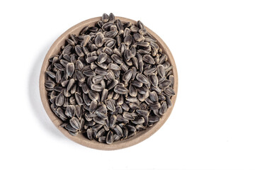 Sunflower seeds in a plate on a white background
