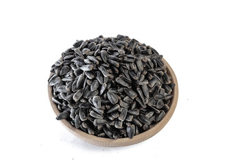 Sunflower seeds in a plate on a white background