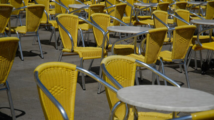 Empty yellow bar chairs in Piazza San Marco in Venezia, during the lockdown.