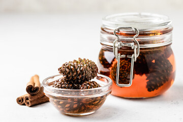Healthy dessert, pine cone jam in a jar. Space for text.
