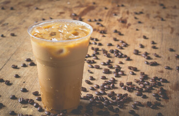ice coffee on wooden table and coffee bean