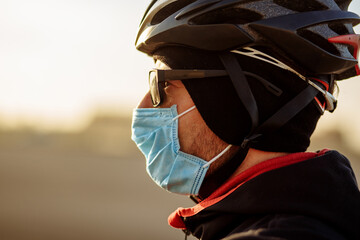 cyclist during quarantine in a helmet and mask
