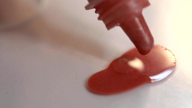 Close up of a bottle apply makeup liquid blush. 