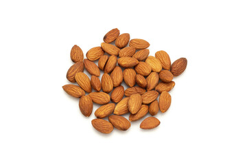 Almonds are placed on the wooden floor at the center of the image, copy space.