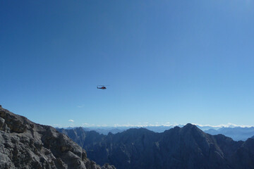 Fototapeta na wymiar Helicopter at Jubilaumsgrat, Zugspitze mountain, Germany