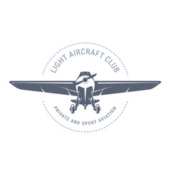 Light aviation emblem with biplane , vintage airplane icon,  propeller aircraft front view logo, vector illustration © gomixer