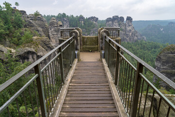 Fototapeta na wymiar Bastei is a sandstone formation with an observation deck in Saxon Switzerland on the right bank of the Elbe River between the resort of Rathen and the city of Velen