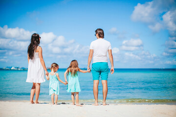 Young family on summer beach vacation