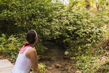 Woman is watching the water flow