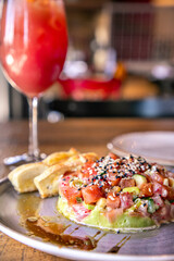 salmon tartare with a cocktail in business lunch