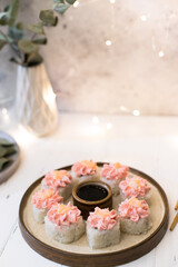 Sushi roll with pink cream, salmon