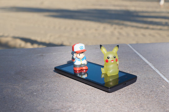 Pokemon go pikachu and Ash Ketchum real with a smartphone