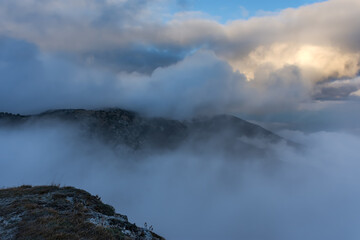 Atmospheric landscape with huge clouds over the mountain. Dramatic skies enveloped the mountains. Sad autumn landscape before the rain. Crimean nature reserve view from the gazebo of winds.