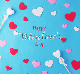 Happy Valentine's Day hearts with blue background.