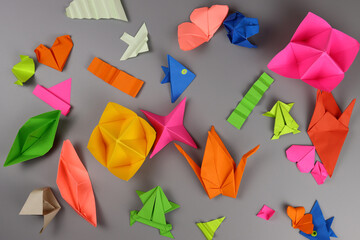 origami crafts out of paper on a gray table