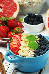 Healthy diet breakfast including cereal with berry and fruits